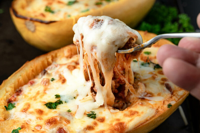 A cheesy fork pull of Lasagna Baked Spaghetti Squash